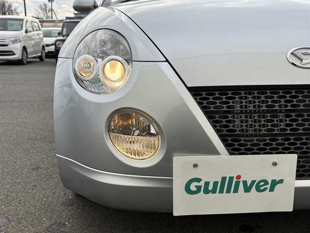 ダイハツ コペン アクティブトップ 岩手県 2002(平14)年 2.2万km ブライトシルバーメタリック 禁煙車/5MT/赤レザーシート/momoステアリング/ファッションバー/前席シートヒーター/電動オープン/フォグライト/〇キーレス/〇電動ミラー/〇社外フロアマット/〇シガーソケット/〇パワーウィンドウ/〇パワーステアリング/取扱説明書