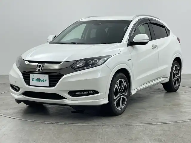 ホンダ ヴェゼル ハイブリッド Z ホンダセンシング 群馬県 2016(平28)年 7.6万km ホワイトオーキッドパール 純正メーカーナビ/バックカメラ/ホンダセンシング/ステアリングスイッチ/ドアバイザー/革巻きステアリング/ETC/ハーフレザーシート/シートヒーター/電動格納ミラー/前後ドライブレコーダー/純正フロアマット/純正アルミホイール/レーンキープアシスト/オートライト/LEDヘッドライト/プッシュスタート/レーダークルーズコントロール