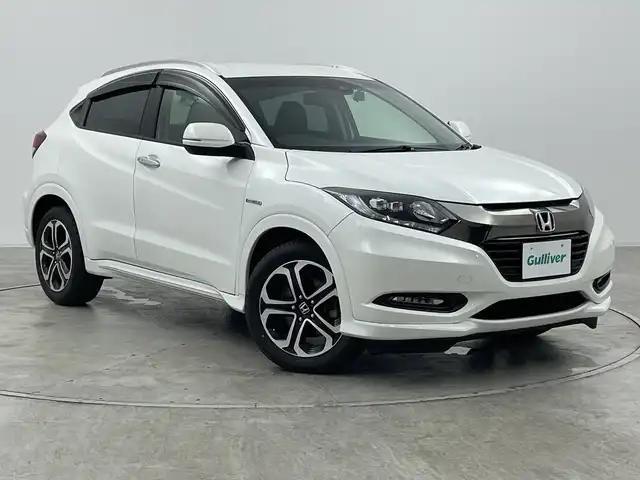ホンダ ヴェゼル ハイブリッド Z ホンダセンシング 群馬県 2016(平28)年 7.6万km ホワイトオーキッドパール 純正メーカーナビ/バックカメラ/ホンダセンシング/ステアリングスイッチ/ドアバイザー/革巻きステアリング/ETC/ハーフレザーシート/シートヒーター/電動格納ミラー/前後ドライブレコーダー/純正フロアマット/純正アルミホイール/レーンキープアシスト/オートライト/LEDヘッドライト/プッシュスタート/レーダークルーズコントロール