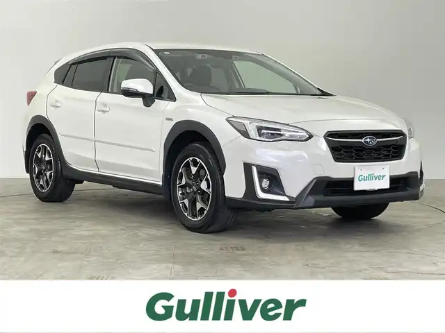 スバル ＸＶ ハイブリッド 2．0e－L アイサイト 千葉県 2019(令1)年 1.9万km クリスタルホワイトP ワンオーナー/4WD/禁煙/衝突軽減ブレーキ/純正8型ナビ（NR-MZ300-BIN-3）/CD/DVD/Bluetooth/フルセグ/バックカメラ/サイドカメラ/レーダークルーズコントロール/レーンアシスト/パドルシフト/パワーシート/メモリシート/ブラインドスポットモニター/LEDヘッドライト/フォグライト/ステアリングレスポンシブヘッドランプ/ステアリングスイッチ/横滑り防止機能/ETC/純正17インチアルミホイール/スマートキー/スペアキー/保証書/取扱説明書