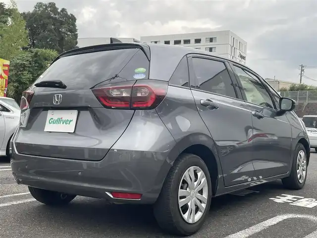 ホンダ フィット ベーシック 長崎県 2020(令2)年 6.6万km シャイニンググレーM ワンオーナー/プッシュスタート/社外SDナビ（AM/FM/DVD/SD）/ブルートゥース/ETC/クルーズコントロール（追従有）/ブレーキホールド/アイドリングストップ/USB/横滑り防止装置/衝突軽減ブレーキ/コーナーセンサー（前後）/ステアリングスイッチ/車線逸脱抑制装置/踏み間違い衝突軽減/電格ミラー/レーンキープアシスト/ブレーキホールド/スペアキー/取説/保証書