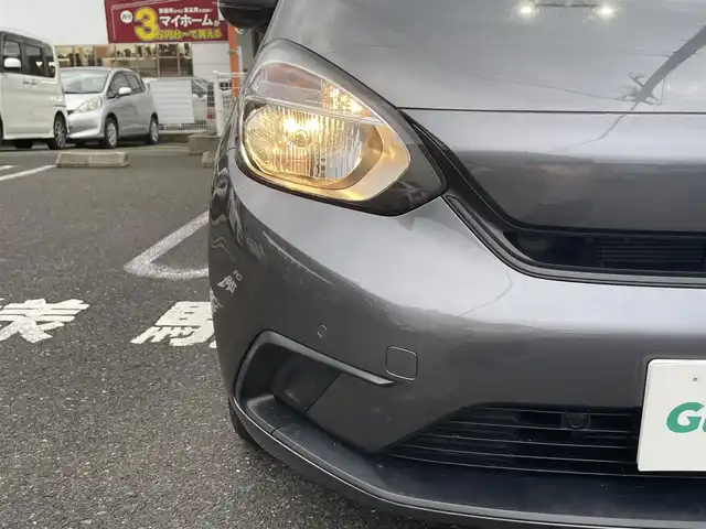ホンダ フィット ベーシック 長崎県 2020(令2)年 6.6万km シャイニンググレーM ワンオーナー/プッシュスタート/社外SDナビ（AM/FM/DVD/SD）/ブルートゥース/ETC/クルーズコントロール（追従有）/ブレーキホールド/アイドリングストップ/USB/横滑り防止装置/衝突軽減ブレーキ/コーナーセンサー（前後）/ステアリングスイッチ/車線逸脱抑制装置/踏み間違い衝突軽減/電格ミラー/レーンキープアシスト/ブレーキホールド/スペアキー/取説/保証書