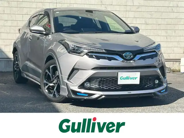 トヨタ Ｃ－ＨＲ G 大分県 2019(平31)年 12.4万km メタルストリームM ・ワンオーナー/Toyota Safety Sense /　プリクラッシュセーフティシステム（歩行者検知機能付/ 　衝突回避支援タイプ/   ミリ波レーダー＋単眼カメラ方式）/　レーンディパーチャーアラート（ステアリング制御付）/　オートマチックハイビーム/　レーダークルーズコントロール（全車速追従機能付）/・純正ナビ　NSZT-Y68T/　ワンセグテレビ/　BT/　DVD/　SD/　ラジオ/・モデリスタフルエアロ/・プッシュエンジンスタート/・ETC/・ヒートシーター　運転席/助手席/・ブラインドスポットモニター/・電動ランバーサポート　運転席/・オートワイパー（雨滴感応式）/・ドラレコ前 DRT-C68A/・ステアリングスイッチ/・横滑り防止システム/・ウィンカーミラー/・LEDランプ/・革巻きステアリング/・レベライザー/・プライバシーガラス/・革巻きステアリング/・トノカバー/・純正フロアマット/・純正18インチアルミホイル/・ドアバイザー/・保証書/・取扱説明書/・スペアキー２本/　
