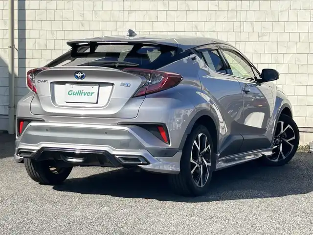 トヨタ Ｃ－ＨＲ G 大分県 2019(平31)年 12.4万km メタルストリームM ・ワンオーナー/Toyota Safety Sense /　プリクラッシュセーフティシステム（歩行者検知機能付/ 　衝突回避支援タイプ/   ミリ波レーダー＋単眼カメラ方式）/　レーンディパーチャーアラート（ステアリング制御付）/　オートマチックハイビーム/　レーダークルーズコントロール（全車速追従機能付）/・純正ナビ　NSZT-Y68T/　ワンセグテレビ/　BT/　DVD/　SD/　ラジオ/・モデリスタフルエアロ/・プッシュエンジンスタート/・ETC/・ヒートシーター　運転席/助手席/・ブラインドスポットモニター/・電動ランバーサポート　運転席/・オートワイパー（雨滴感応式）/・ドラレコ前 DRT-C68A/・ステアリングスイッチ/・横滑り防止システム/・ウィンカーミラー/・LEDランプ/・革巻きステアリング/・レベライザー/・プライバシーガラス/・革巻きステアリング/・トノカバー/・純正フロアマット/・純正18インチアルミホイル/・ドアバイザー/・保証書/・取扱説明書/・スペアキー２本/　