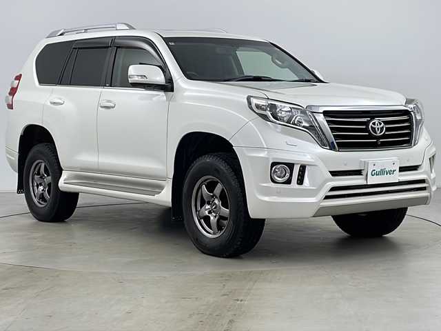 トヨタ ランドクルーザー プラド TX Lパッケージ 道央・札幌 2016(平28)年 8万km ホワイトパールクリスタルシャイン ・寒冷地仕様/・純正ナビCD&DVD&BT&AUX&SD&USB/・サンルーフ/・バック/フロント/サイドカメラ/・クルーズコントロール/・コーナーセンサー/・横滑り防止装置/・ダウンヒルアシスト/・前席シートヒーター/・レザーシート/・ビルトインETC/・nanoe/・社外マフラー/・SOREXヒッチメンバー/・電動格納ミラー/・プッシュスタート/・LEDヘッドライト/・オートライト/・スマートキー/・スペアキー/・エンジンスターター/・社外AW夏タイヤ積込/・保証書/・取扱説明書