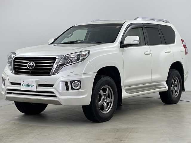 トヨタ ランドクルーザー プラド TX Lパッケージ 道央・札幌 2016(平28)年 8万km ホワイトパールクリスタルシャイン ・寒冷地仕様/・純正ナビCD&DVD&BT&AUX&SD&USB/・サンルーフ/・バック/フロント/サイドカメラ/・クルーズコントロール/・コーナーセンサー/・横滑り防止装置/・ダウンヒルアシスト/・前席シートヒーター/・レザーシート/・ビルトインETC/・nanoe/・社外マフラー/・SOREXヒッチメンバー/・電動格納ミラー/・プッシュスタート/・LEDヘッドライト/・オートライト/・スマートキー/・スペアキー/・エンジンスターター/・社外AW夏タイヤ積込/・保証書/・取扱説明書