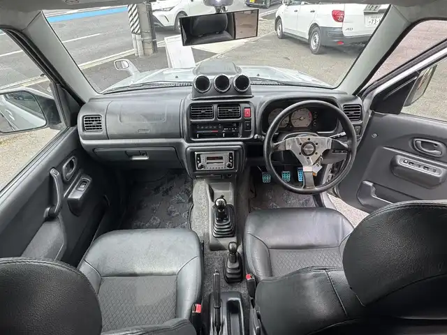 スズキ ジムニー ランドベンチャー 愛知県 2003(平15)年 15.4万km シルキーシルバーメタリック ユーザー買取車/禁煙車/ハーフレザーシート/モモステアリング/F5速/リフトアップ/4WD/社外F.R ショートバンパー/社外マフラー（ウイルスウイン）/リヤスポイラー