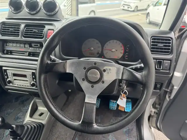 スズキ ジムニー ランドベンチャー 愛知県 2003(平15)年 15.4万km シルキーシルバーメタリック ユーザー買取車/禁煙車/ハーフレザーシート/モモステアリング/F5速/リフトアップ/4WD/社外F.R ショートバンパー/社外マフラー（ウイルスウイン）/リヤスポイラー