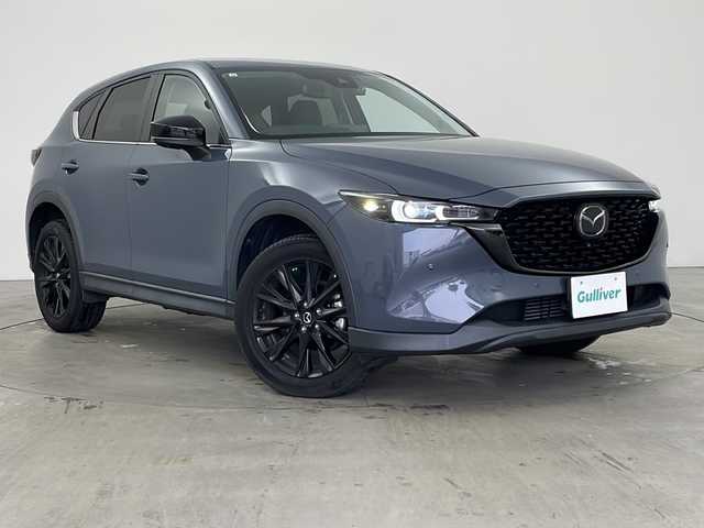 マツダ ＣＸ－５ XD ブラックトーンエディション 兵庫県 2021(令3)年 1.4万km ポリメタルグレーM ・純正10.25インチナビ（SDカード欠品）/・Bluetooth/USB/フルセグテレビ/・360°ビューモニター/・i-ACTIVE　SENSE/・スマート・ブレーキ・サポート/・スマート・シティ・ブレーキ・サポート/・レーダクルーズコントロール/・ドライバーアテンションアラート/・車間認知支援システム/・車線逸脱警報/・ブラインドスポットモニター/・横滑り防止装置/・レーンキープアシストシステム/・オートマチックハイビーム/・電子パーキングブレーキ/・オートホールドブレーキ/・パワーバックドア/・ヘッドアップディスプレイ/・ステアリングスイッチ/・ステアリングヒーター/・パドルシフト/・横滑り防止装置/・ハーフレザーシート/・前席シートヒーター/・運転席パワーシート/・社外フロアマット/・LEDヘッドライト/・フォグライト/・純正19インチアルミホイールタイヤ/・電動格納ミラー/・前方ドライブレコーダー/・ETC2.0/・スマートキー/・スペアキー