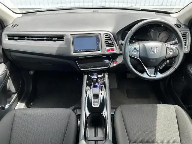 ホンダ ヴェゼル ハイブリッド X 熊本県 2015(平27)年 2.5万km クリスタルブラックパール 純正ナビ/・AM/FM/CD/DVD/BT/SD/・ワンセグTV/・バックカメラ/あんしんパッケージ/・シティブレーキアクティブシステム/・サイドカーテンエアバッグシステム/・前席用i-サイドエアバッグシステム/・VSA/・エマージェンシーストップシグナル/・ヒルスタートアシスト機能/・ファイブスター賞/電動パーキングブレーキ/・ブレーキホールド/本革巻ステアリング/・ステアリングスイッチ/・パドルシフト/布シート/走行モード切替/・スポーツモード/ノーマルモード/ECOモード/純正16インチAW/純正フロアマット/プッシュスタート/・スマートキー/ETC