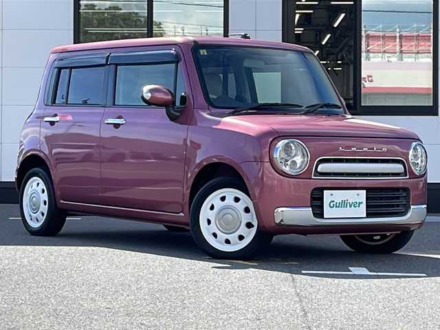 スズキ ラパン X 山口県 2014(平26)年 4.9万km カシスピンクパールメタリック 社外メモリーナビ【MDV-L401】/・DVD/CD/iPod/USB/ワンセグ/AM/FM/純正フロアマット/純正アルミホイール/レザーシート/ベンチシート/本革巻きステアリング/フルオートエアコン/アイドリングストップ/LEDヘッドランプ/オートライト/電動格納ウインカーミラー/ドアバイザー/スマートキー/プッシュアップスタート/ABS/盗難防止装置/取扱説明書/保証書