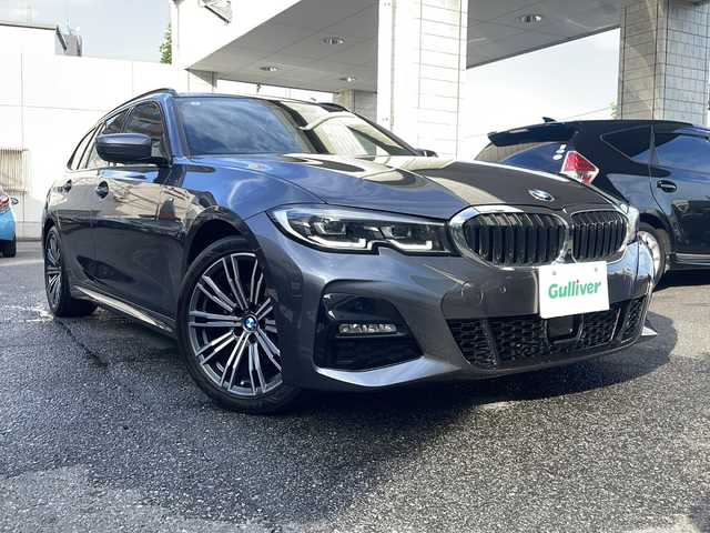 ＢＭＷ ３２０ｉ ツーリング Mスポーツ 東京都 2020(令2)年 3.9万km ミネラルグレー ワンオーナー/ドライビングアシストプロフェッショナル/・アクティブクルーズコントロール/・ステアリング/レーンコントロール/・レーンディパーチャーウォーニング/・レーンチェンジウォーニング/・アクティブサイドコリジョンプロテクション/・クロストラフィックウォーニング/・前車接近警告機能/・後車衝突警告機能/・エマージェンシーストップアシスト/・トラフィックサインアシスト/・衝突回避/被害軽減ブレーキ/・高速道路渋滞時ハンズオフアシスト/・エマージェンシーストップアシスト/・トラフィックサインアシスト（速度制限）/HDDナビ（10.25インチワイドディスプレイ）/パークディスタンスコントロール/パーキングアシスト/リアビューカメラ/リバースアシスト/アダプティブLEDヘッドランプ/ハイビームアシスタント/Mエンブレム付革巻きステアリング/パドルシフト/ETC/12.3インチマルチディスプレイメーターパネル/パワーシート（前席）/シートヒーター（前席）/パワーバックドア/コンフォートアクセス（スマートオープン/クローズ機能）