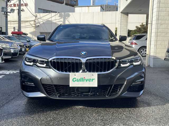 ＢＭＷ ３２０ｉ ツーリング Mスポーツ 東京都 2020(令2)年 3.9万km ミネラルグレー ワンオーナー/ドライビングアシストプロフェッショナル/・アクティブクルーズコントロール/・ステアリング/レーンコントロール/・レーンディパーチャーウォーニング/・レーンチェンジウォーニング/・アクティブサイドコリジョンプロテクション/・クロストラフィックウォーニング/・前車接近警告機能/・後車衝突警告機能/・エマージェンシーストップアシスト/・トラフィックサインアシスト/・衝突回避/被害軽減ブレーキ/・高速道路渋滞時ハンズオフアシスト/・エマージェンシーストップアシスト/・トラフィックサインアシスト（速度制限）/HDDナビ（10.25インチワイドディスプレイ）/パークディスタンスコントロール/パーキングアシスト/リアビューカメラ/リバースアシスト/アダプティブLEDヘッドランプ/ハイビームアシスタント/Mエンブレム付革巻きステアリング/パドルシフト/ETC/12.3インチマルチディスプレイメーターパネル/パワーシート（前席）/シートヒーター（前席）/パワーバックドア/コンフォートアクセス（スマートオープン/クローズ機能）