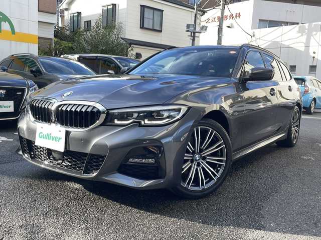 ＢＭＷ ３２０ｉ ツーリング Mスポーツ 東京都 2020(令2)年 3.9万km ミネラルグレー ワンオーナー/ドライビングアシストプロフェッショナル/・アクティブクルーズコントロール/・ステアリング/レーンコントロール/・レーンディパーチャーウォーニング/・レーンチェンジウォーニング/・アクティブサイドコリジョンプロテクション/・クロストラフィックウォーニング/・前車接近警告機能/・後車衝突警告機能/・エマージェンシーストップアシスト/・トラフィックサインアシスト/・衝突回避/被害軽減ブレーキ/・高速道路渋滞時ハンズオフアシスト/・エマージェンシーストップアシスト/・トラフィックサインアシスト（速度制限）/HDDナビ（10.25インチワイドディスプレイ）/パークディスタンスコントロール/パーキングアシスト/リアビューカメラ/リバースアシスト/アダプティブLEDヘッドランプ/ハイビームアシスタント/Mエンブレム付革巻きステアリング/パドルシフト/ETC/12.3インチマルチディスプレイメーターパネル/パワーシート（前席）/シートヒーター（前席）/パワーバックドア/コンフォートアクセス（スマートオープン/クローズ機能）