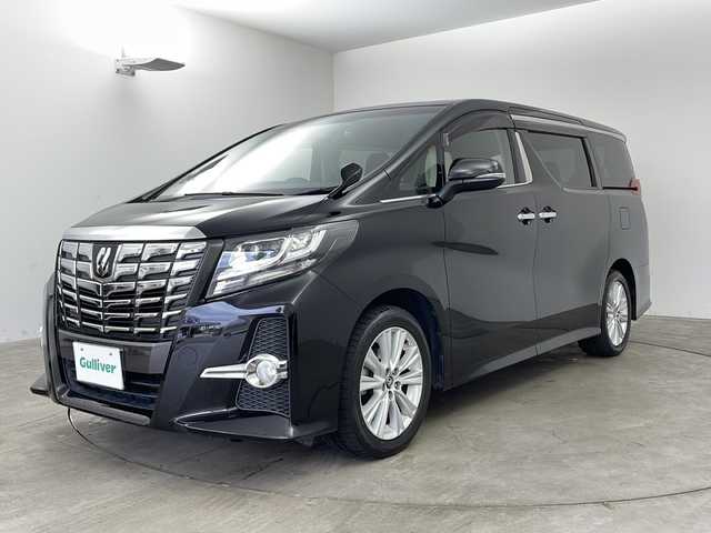 トヨタ アルファード S 兵庫県 2015(平27)年 12.1万km ブラック ・純正ナビ/CD/DVD/SD/Bluetooth接続/TV/・バックカメラ/・社外ドライブレコーダー/・ビルトインETC/・純正リアフリップダウンモニター/・クリアランスソナー/・2列目オットマンシート/・nanoe/・W＋サイドエアバッグ/・両側パワースライドドア/・カーテンエアバッグ/・LEDヘッドランプ/・スマートキー/・純正18インチアルミホイール