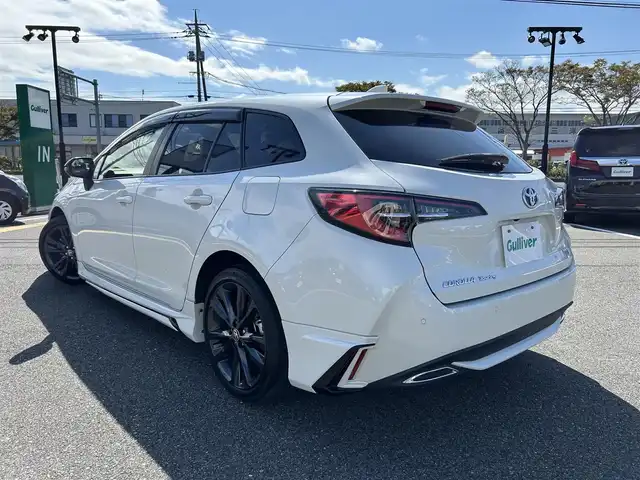 トヨタ カローラツーリング ハイブリッド ダブルバイビー 鳥取県 2020(令2)年 4.5万km ホワイトパールクリスタルシャイン 4・W・D/純正9型ナビ/フルセグ/DVD/CD/BT/USB/バックカメラ・ビルトインETC/前後ドライブレコーダー/ハーフレザーシート/前席シートヒーター/ステアリングヒーター/モデリスタエアロパーツ/トヨタセーフティセンス/レーダークルーズコントロール/レーンキープアシスト/LEDヘッドライト/LEDフォグライト/純正17インチアルミホイール/プッシュエンジンスタート/フロアマット/ドアバイザー/保証書/スペアキー