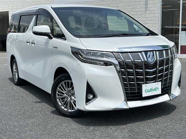 トヨタ アルファードハイブリット G 千葉県 2019(平31)年 1.8万km ホワイトパールクリスタルシャイン ワンオーナー/純正9インチSDナビ/フルセグTV/Bluetooth/DVD/CD/USB/フリップダウンモニター/ETC2.0/全周囲カメラ/バックカメラ/3眼LEDライト/JBLサウンド/デジタルインナーミラー/PCS/LTA/PKSB/RCTA/RSA/アダプティブクルーズコントロール/パワーバックドア/純正17インチアルミホイール/D＋N席パワーシート/D＋N席シートヒーター/エアシート/両側パワースライドドア/純正フロアマット/オットマン/横滑り防止装置/保証書/取扱説明書/記録薄