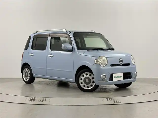 ダイハツ ミラ ココア プラスX 埼玉県 2010(平22)年 8.8万km ミストブルーマイカメタリック 純正ナビ　NSZN-W60/(CD/DVD/AUX/AM/FM)/バックカメラ/ルーフレール/前席シートカバー付/純正フロアマット/純正ドアバイザー/レベライザー/シガーソケット/フロントフォグランプ/ウィンカーミラー