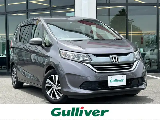 ホンダ フリード ハイブリット G ホンダセンシング 栃木県 2018(平30)年 7.1万km モダンスティールM 衝突被害軽減ブレーキ（CMBS）/ホンダセンシング/純正9インチナビ/フルセグTV/DVD/Bluetooth/バックカメラ/ビルトインETC/前後ドライブレコーダー/両側パワースライドドア/クルーズコントロール/プッシュスタート/ステアリングリモコン/LEDオートライト/純正15インチAW/アイドリングストップ/横滑り防止装置/保証書/取説/ドアバイザー/電動格納ミラー