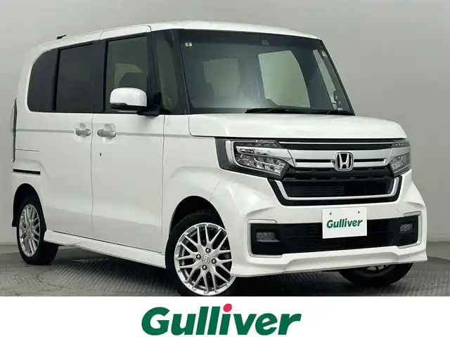 ホンダ Ｎ ＢＯＸ カスタム EX ターボ 道央・札幌 2023(令5)年 1.6万km パール ・４WD/・寒冷地仕様/・DOPモニター付オーディオ（WX-211C）/　CD/BT/ipod/ワンセグTV/・バックカメラ/・ビルトインETC/・衝突被害軽減ブレーキ/・レーンキープアシスト/・クリアランスソナー/・横滑り防止装置/・両側パワースライドドア/・オートライト/・LEDヘッドライト/・LEDフォグランプ/・ハーフレザーシート/・D+N席シートヒーター/・純正１５インチAW/・純正フロアマット/・プッシュスタート/・スマートキー