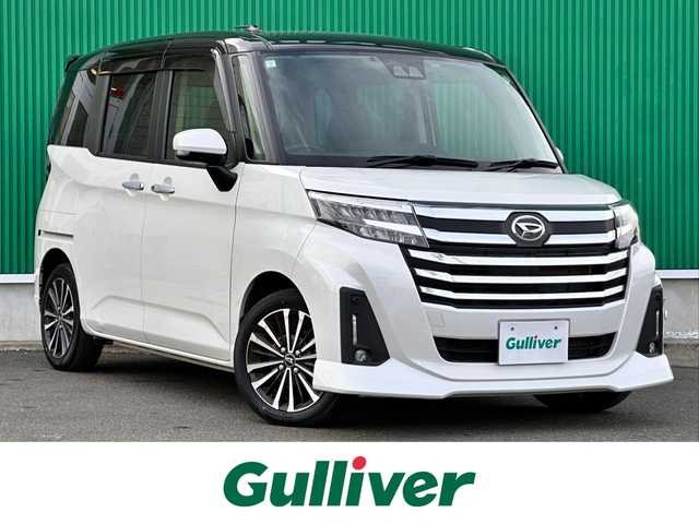 ダイハツ トール カスタムG ターボ 宮城県 2023(令5)年 1.7万km ブラックマイカメタリック/パールホワイトⅢ 2トーン コンフォータブルパック/・シートヒーター（運転席/助手席）/・シートバックテーブル（運転席/助手席）/＝＝＝/ワンオーナー/スマートアシスト/・衝突警報機能/・衝突回避支援ブレーキ機能/・ブレーキ制御付誤発進抑制機能/・先行車発進お知らせ機能/・アダプティブドライビングビーム/・アダプティブクルーズコントロール/・ふらつき警報/・サイドビューランプ/・コーナーセンサー/・路側逸脱警報/・標識認識機能/純正フリップダウンモニター/純正9インチナビ（NMZL-Y73D）/・CD/DVD/・Bluetooth/・フルセグTV/バックカメラ/ビルトインETC2.0/ウェルカムパワースライドドア（両側）/シートヒーター/革巻きステアリング/ステアリングスイッチ/LEDヘッドランプ/フォグランプ/オートライト/電動パーキングブレーキ/ブレーキホールド/スマートキー＆プッシュスタート/スペアキー/電動格納ミラー/純正リヤスポイラー（モデリスタセレクション）/純正コンソールBOX/純正クリーンポケット/純正15インチAW/純正ドアバイザー/純正フロアマット/Wエアバッグ