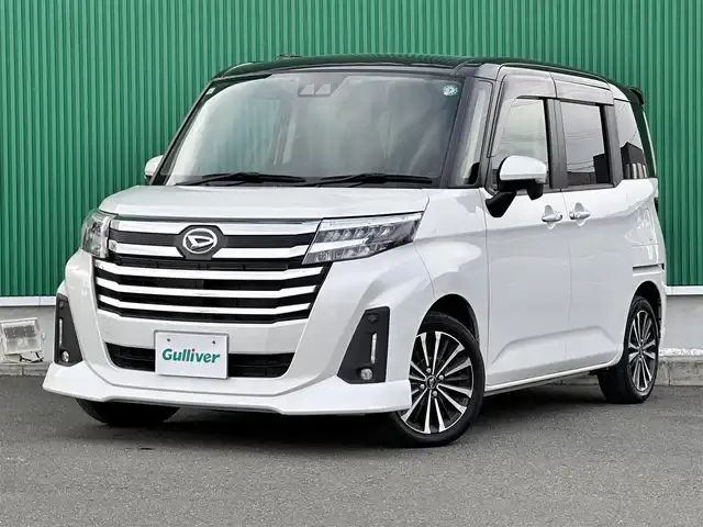 ダイハツ トール カスタムG ターボ 宮城県 2023(令5)年 1.7万km ブラックマイカメタリック/パールホワイトⅢ 2トーン コンフォータブルパック/・シートヒーター（運転席/助手席）/・シートバックテーブル（運転席/助手席）/＝＝＝/ワンオーナー/スマートアシスト/・衝突警報機能/・衝突回避支援ブレーキ機能/・ブレーキ制御付誤発進抑制機能/・先行車発進お知らせ機能/・アダプティブドライビングビーム/・アダプティブクルーズコントロール/・ふらつき警報/・サイドビューランプ/・コーナーセンサー/・路側逸脱警報/・標識認識機能/純正フリップダウンモニター/純正9インチナビ（NMZL-Y73D）/・CD/DVD/・Bluetooth/・フルセグTV/バックカメラ/ビルトインETC2.0/ウェルカムパワースライドドア（両側）/シートヒーター/革巻きステアリング/ステアリングスイッチ/LEDヘッドランプ/フォグランプ/オートライト/電動パーキングブレーキ/ブレーキホールド/スマートキー＆プッシュスタート/スペアキー/電動格納ミラー/純正リヤスポイラー（モデリスタセレクション）/純正コンソールBOX/純正クリーンポケット/純正15インチAW/純正ドアバイザー/純正フロアマット/Wエアバッグ