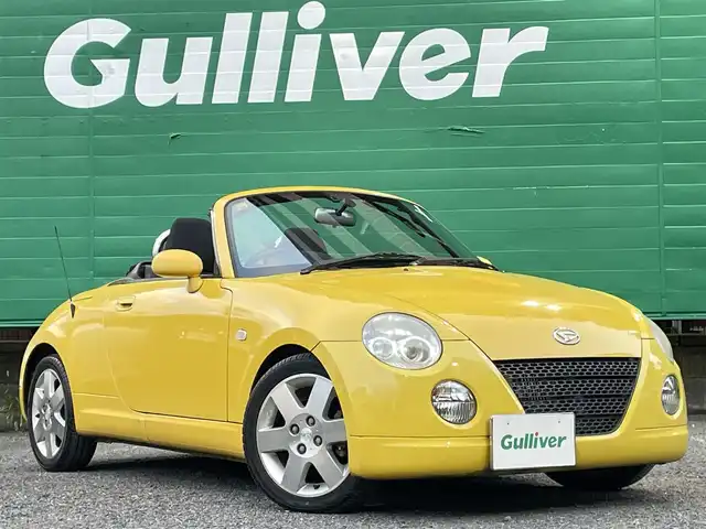 ダイハツ コペン アクティブトップ 東京都 2002(平14)年 4.6万km ジョーヌイエロー ワンオーナー/禁煙車/Gパック/・プロジェクター式HIDヘッドランプ/・イモビライザー/・MD/CD/・2スピーカー/アクティブトップ/ブラックファブリックシート/純正アルミホイール/純正フロアマット/リモコンキー/スペアキー×1