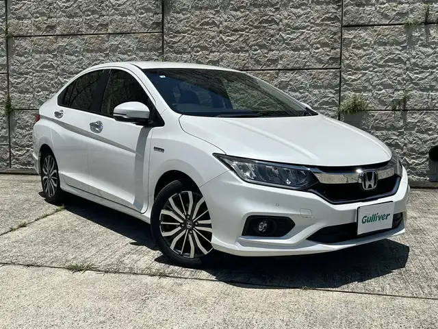 ホンダ グレイス ハイブリッド EX 長崎県 2020(令2)年 7.2万km プラチナホワイトパール 純正メモリナビ/　(CD DVD BT USB AUX ワンセグTV)/クルーズコントロール/バックカメラ/パドルシフト/純正ドライブレコーダー/シートヒーター/ハーフレザーシート/コーナーセンサー/ビルドインETC/オートライト/LEDヘッドライト/純正16インチアルミホイール/横滑り防止機能/スマートキー/スペアキー×1/保証書　取扱説明書
