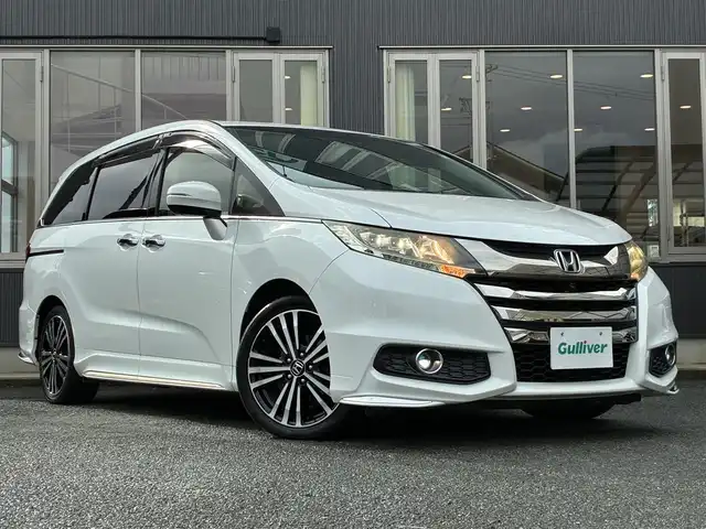 ホンダ オデッセイ アブソルート EX 京都府 2015(平27)年 7.5万km ホワイトオーキッドパール インターナビ/・マルチビューカメラ/・スマートパーキングアシストシステム/・フルセグTV/・CD/DVD再生/・HDMI/USB入力端子/・BT接続/リアエンターテイメントシステム/Bin ETC/社外ドラレコ/両側パワースライドドア/ホンダセンシング/・衝突軽減ブレーキ/・誤発進抑制機能/・先行車発進お知らせ機能/・車線維持支援システム/・標識認識機能/・路外逸脱抑制機能/・アダプティブクルーズコントロール/ハーフレザーシート/・運転席パワーシート/2列目シートオットマン付キャプテンシート/レザーステアリング/・パドルシフト/・ステアリモコン/トリプルゾーンフルオートエアコン/プッシュスタート/・スマートキー/LEDヘッドライト/・フォグランプ/純正18インチアルミホイール/純正ドアバイザー/純正フロアマット/車両保証書/車両取説
