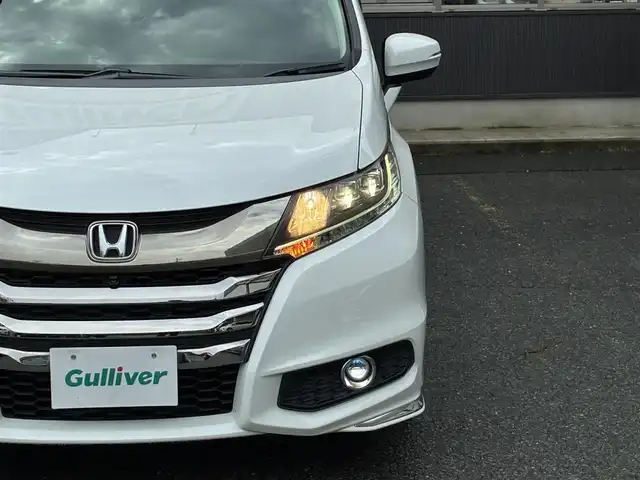 ホンダ オデッセイ アブソルート EX 京都府 2015(平27)年 7.5万km ホワイトオーキッドパール インターナビ/・マルチビューカメラ/・スマートパーキングアシストシステム/・フルセグTV/・CD/DVD再生/・HDMI/USB入力端子/・BT接続/リアエンターテイメントシステム/Bin ETC/社外ドラレコ/両側パワースライドドア/ホンダセンシング/・衝突軽減ブレーキ/・誤発進抑制機能/・先行車発進お知らせ機能/・車線維持支援システム/・標識認識機能/・路外逸脱抑制機能/・アダプティブクルーズコントロール/ハーフレザーシート/・運転席パワーシート/2列目シートオットマン付キャプテンシート/レザーステアリング/・パドルシフト/・ステアリモコン/トリプルゾーンフルオートエアコン/プッシュスタート/・スマートキー/LEDヘッドライト/・フォグランプ/純正18インチアルミホイール/純正ドアバイザー/純正フロアマット/車両保証書/車両取説