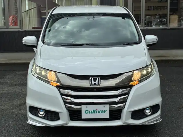 ホンダ オデッセイ アブソルート EX 京都府 2015(平27)年 7.5万km ホワイトオーキッドパール インターナビ/・マルチビューカメラ/・スマートパーキングアシストシステム/・フルセグTV/・CD/DVD再生/・HDMI/USB入力端子/・BT接続/リアエンターテイメントシステム/Bin ETC/社外ドラレコ/両側パワースライドドア/ホンダセンシング/・衝突軽減ブレーキ/・誤発進抑制機能/・先行車発進お知らせ機能/・車線維持支援システム/・標識認識機能/・路外逸脱抑制機能/・アダプティブクルーズコントロール/ハーフレザーシート/・運転席パワーシート/2列目シートオットマン付キャプテンシート/レザーステアリング/・パドルシフト/・ステアリモコン/トリプルゾーンフルオートエアコン/プッシュスタート/・スマートキー/LEDヘッドライト/・フォグランプ/純正18インチアルミホイール/純正ドアバイザー/純正フロアマット/車両保証書/車両取説