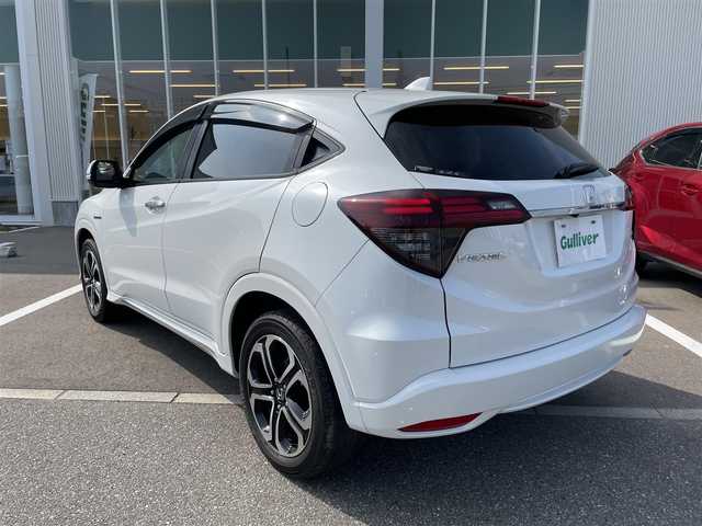 ホンダ ヴェゼル ハイブリッド Z ホンダセンシング 石川県 2020(令2)年 6.7万km プラチナホワイトパール 4WD/純正8型ナビ/CD/DVD/フルセグTV/バックカメラ/LEDヘッドライト/ETC/スマートキー/プッシュスタート/電動ミラー/ホンダセンシング/レーダークルーズ/ハーフレザーシート/ドライブレコーダー/保証書