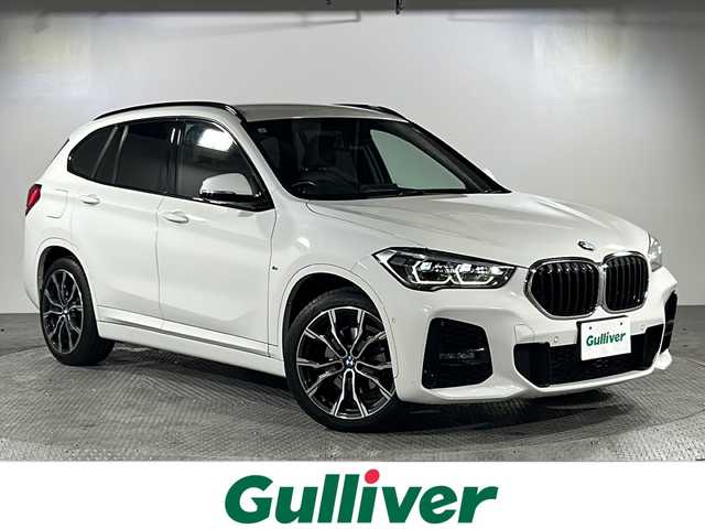 ＢＭＷ Ｘ１ xDrive 18d Mスポーツ 沖縄県 2021(令3)年 3.7万km アルピンホワイトⅢ 禁煙車　/純正ナビ　/（Ｂｌｕｅｔｏｏｔｈ　ＦＭ　ＡＭ　ＵＳＢ）　/バックカメラ/メモリー機能付きパワーシート　/オットマン（N席）　/アダプティブクルーズコントロール　/前後コーナーセンサー　/ＥＴＣ　/パドルシフト/電動パーキングブレーキ/USBポート/LEDヘッドライト/純正アルミホイール/衝突被害軽減ブレーキ/車線逸脱警報機能