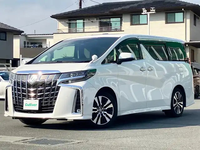 トヨタ アルファード S Cパッケージ 静岡県 2020(令2)年 5.8万km ホワイトパールクリスタルシャイン 純正10インチナビ（CD/DVD/BT/フルセグ）/純正12.1インチ後席モニター/バックカメラ/ツインサンルーフ/電動リアゲート/D席N席パワーシート/D席N席シートヒーター/D席N席エアシート/N席電動オットマン/２列目電動リクライニング/２列目電動オットマン/純正フロアマット車載/純正エントランスマット車載/シーケンシャルウインカー/三眼LEDヘッドライト/ステアリングヒーター/エンジンスタートボタン/パワーステアリング/パワーウィンドウ/100V充電/保証書/取扱説明書/記録簿/スマートキー/レーダークルーズコントロール/ETC/USB入力端子/三列シート/ウォークスルー/両側パワースライドドア/純正18インチアルミホイール/ABS/横滑り防止装置/コーナーセンサー前後/レーンキープアシスト/盗難防止装置/オートライト/オートマチックハイビーム/W+サイドエアバック/衝突軽減システム/カーテンエアバック