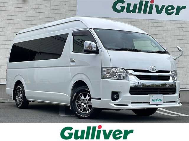 トヨタ ハイエース ファインテックツアラー 山形県 2023(令5)年 0.4万km ホワイトパールクリスタルシャイン 禁煙車/寒冷地仕様/モデリスタフロントエアロ/TRD15インチアルミホイール/EAGLE＃１ホワイトレタータイヤ/Toyota Safety Sense /・プリクラッシュセーフティ/・レーンディパーチャーアラート/・オートマチックハイビーム/パノラミックビューモニター/クリアランスソナー/純正ナビ(CD.DVD.BT)/フルセグ/デジタルインナーミラー/片側パワースライドドア/ビルトインETC2.0/純正ドライブレコーダー/AC１００V/２・３列目オットマン/LEDヘッドライト/LEDフォグ/純正エンジンスターター/スマートキーｘ２/プッシュスタート