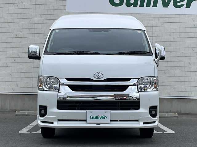トヨタ ハイエース ファインテックツアラー 山形県 2023(令5)年 0.4万km ホワイトパールクリスタルシャイン 禁煙車/寒冷地仕様/モデリスタフロントエアロ/TRD15インチアルミホイール/EAGLE＃１ホワイトレタータイヤ/Toyota Safety Sense /・プリクラッシュセーフティ/・レーンディパーチャーアラート/・オートマチックハイビーム/パノラミックビューモニター/クリアランスソナー/純正ナビ(CD.DVD.BT)/フルセグ/デジタルインナーミラー/片側パワースライドドア/ビルトインETC2.0/純正ドライブレコーダー/AC１００V/２・３列目オットマン/LEDヘッドライト/LEDフォグ/純正エンジンスターター/スマートキーｘ２/プッシュスタート