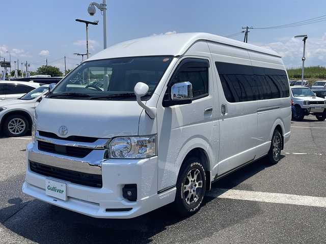 トヨタ ハイエース ファインテックツアラー 新潟県 2023(令5)年 0.4万km ホワイトパールクリスタルシャイン 禁煙車/寒冷地仕様/モデリスタフロントエアロ/TRD15インチアルミホイール/EAGLE＃１ホワイトレタータイヤ/Toyota Safety Sense /・プリクラッシュセーフティ/・レーンディパーチャーアラート/・オートマチックハイビーム/パノラミックビューモニター/クリアランスソナー/純正ナビ(CD.DVD.BT)/フルセグ/デジタルインナーミラー/片側パワースライドドア/ビルトインETC2.0/純正ドライブレコーダー/AC１００V/２・３列目オットマン/LEDヘッドライト/LEDフォグ/純正エンジンスターター/スマートキーｘ２/プッシュスタート