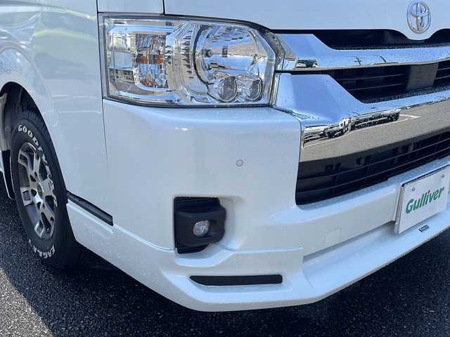 トヨタ ハイエース ファインテックツアラー 新潟県 2023(令5)年 0.4万km ホワイトパールクリスタルシャイン 禁煙車/寒冷地仕様/モデリスタフロントエアロ/TRD15インチアルミホイール/EAGLE＃１ホワイトレタータイヤ/Toyota Safety Sense /・プリクラッシュセーフティ/・レーンディパーチャーアラート/・オートマチックハイビーム/パノラミックビューモニター/クリアランスソナー/純正ナビ(CD.DVD.BT)/フルセグ/デジタルインナーミラー/片側パワースライドドア/ビルトインETC2.0/純正ドライブレコーダー/AC１００V/２・３列目オットマン/LEDヘッドライト/LEDフォグ/純正エンジンスターター/スマートキーｘ２/プッシュスタート