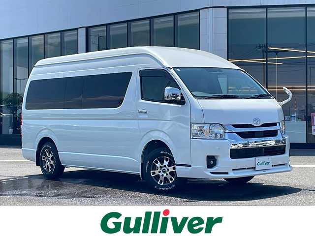 トヨタ ハイエース ファインテックツアラー 新潟県 2023(令5)年 0.4万km ホワイトパールクリスタルシャイン 禁煙車/寒冷地仕様/モデリスタフロントエアロ/TRD15インチアルミホイール/EAGLE＃１ホワイトレタータイヤ/Toyota Safety Sense /・プリクラッシュセーフティ/・レーンディパーチャーアラート/・オートマチックハイビーム/パノラミックビューモニター/クリアランスソナー/純正ナビ(CD.DVD.BT)/フルセグ/デジタルインナーミラー/片側パワースライドドア/ビルトインETC2.0/純正ドライブレコーダー/AC１００V/２・３列目オットマン/LEDヘッドライト/LEDフォグ/純正エンジンスターター/スマートキーｘ２/プッシュスタート