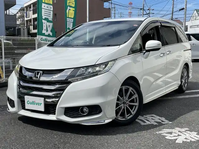 ホンダ オデッセイ アブソルート 埼玉県 2014(平26)年 9.9万km ホワイトオーキッドパール 純正エアロ/ハーフレザーシート/エマージェンシーストップシグナル/シティブレーキアクティブシステム/誤発進抑制機能/クルーズコントロール/社外メモリーナビ/【AVIC-RZ712】/DTV/DVD/BT/USB/SD/AUX/HDMI/iPod/社外フリップダウンモニター/【TVM-FW1000】/両側パワースライドドア/バックカメラ/社外17インチAW/社外車高調/アイドリングストップ/パドルシフト/LEDアウターウェルカムライト/社外ドライブレコーダー前後/【VREC-DH301D】/ドアバイザー/LEDヘッドライト/フォグライト/ビルトインETC/プッシュスタート/スマートキー