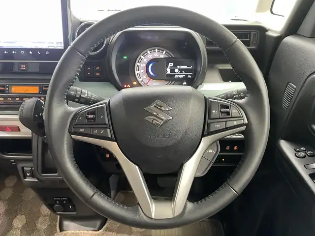 スズキ スペーシア ギア マイスタイル 鹿児島県 2023(令5)年 2.7万km オフブルーメタリック/ホワイト2トーン 純正ナビ/(フルセグTV/Bluetooth/DVD/CD)/全方位モニター/ヘッドアップディスプレイ/スズキセーフティサポート/　・デュアルカメラブレーキサポート/　・誤発進抑制機能/　・車線逸脱抑制機能/　・ふらつき警報機能/　・先行車発進お知らせ機能/　・アダプティブクルーズコントロール/　・標識認識機能/　・ハイビームアシスト/前席シートヒーター/両側パワースライドドア/ロールサンシェード/前後ドライブレコーダー/ETC/純正ドアバイザー/LEDヘッドライト/フォグランプ