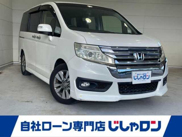 ホンダ ステップワゴン スパーダ Zi 沖縄県 2013(平25)年 6.8万km ホワイトオーキッドパール (株)IDOMが運営する【じしゃロンコザ店】の自社ローン専用車両になりますこちらは現金またはオートローンご利用時の価格です。自社ローンご希望の方は別途その旨お申付け下さい/純正ナビ　/フルセグＴＶ　/バックカメラ　/Ｂｌｕｅｔｏｏｔｈ接続　/ＣＤ／ＤＶＤ再生　/ＥＴＣ　/両側パワースライドドア　/アイドリングストップ　/スマートキー　/スペアキー　/オートライト