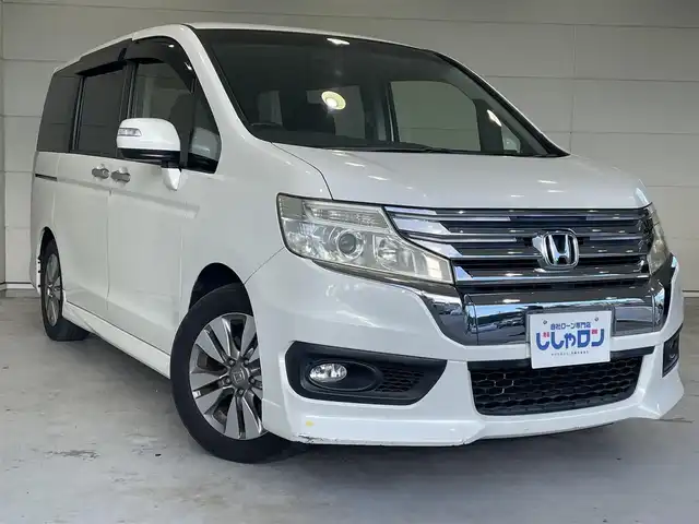 ホンダ ステップワゴン スパーダ Zi 沖縄県 2013(平25)年 6.8万km ホワイトオーキッドパール (株)IDOMが運営する【じしゃロンコザ店】の自社ローン専用車両になりますこちらは現金またはオートローンご利用時の価格です。自社ローンご希望の方は別途その旨お申付け下さい/純正ナビ　/フルセグＴＶ　/バックカメラ　/Ｂｌｕｅｔｏｏｔｈ接続　/ＣＤ／ＤＶＤ再生　/ＥＴＣ　/両側パワースライドドア　/アイドリングストップ　/スマートキー　/スペアキー　/オートライト