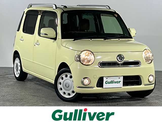 ダイハツ ミラ ココア プラスX スペシャルコーデ 沖縄県 2014(平26)年 8.3万km コットンアイボリー 県外仕入　/禁煙車　/社外ナビ（ＢＴ，フルセグ，ＣＤ／ＤＶＤ，ラジオ）　/バックカメラ　/ルーフレール　/フォグランプ/ＥＴＣ　/純正フロアマット　/ドアバイザー　/ベンチシート/スマートキー