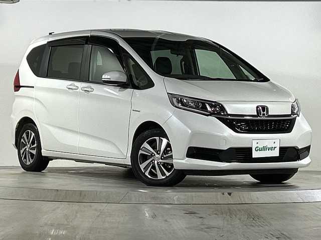 ホンダ フリード ハイブリット G ホンダセンシング 広島県 2020(令2)年 3.1万km プラチナホワイトパール 禁煙/ホンダセンシング/・衝突軽減ブレーキ/・LKAS/・アダプティブクルーズコントロール/・誤発進抑制制御/・標識認識機能/コーナーセンサー/純正8型ナビ（VXM-207VFi）/・フルセグ/CD/DVD/Bluetooth/SD/MusicRack/バックカメラ/オートライト/ステアリングスイッチ/LEDヘッドライト+アクティブコーナリングライト/オートリトラミラー/Cパッケージ/・ロールサンシェード/・シートヒーター（D/N）/・コンフォートビューパッケージ/・IRカット/UVカットガラス/・プラズマクラスターエアコン/Sパッケージ/・コンビシート＆専用インテリア/・15インチアルミホイール/・本革巻ステアリングホイール/・シートバックアッパーポケット/スマートキー/プッシュスタート/スペアキー/純正ドアバイザー/ETC