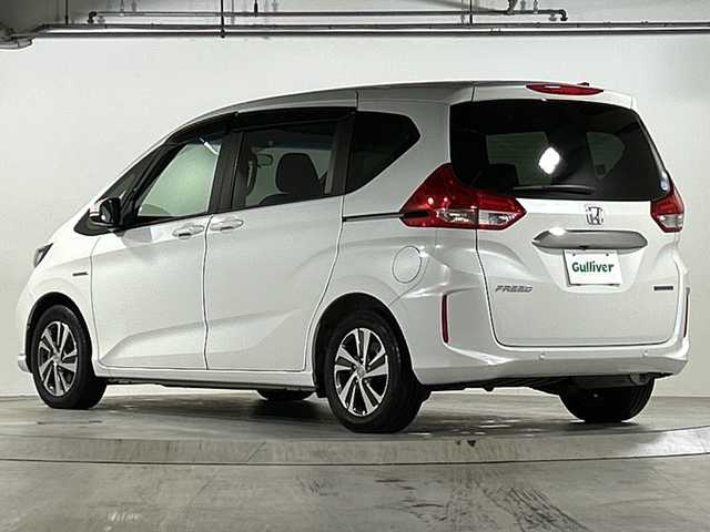 ホンダ フリード ハイブリット G ホンダセンシング 広島県 2020(令2)年 3.1万km プラチナホワイトパール 禁煙/ホンダセンシング/・衝突軽減ブレーキ/・LKAS/・アダプティブクルーズコントロール/・誤発進抑制制御/・標識認識機能/コーナーセンサー/純正8型ナビ（VXM-207VFi）/・フルセグ/CD/DVD/Bluetooth/SD/MusicRack/バックカメラ/オートライト/ステアリングスイッチ/LEDヘッドライト+アクティブコーナリングライト/オートリトラミラー/Cパッケージ/・ロールサンシェード/・シートヒーター（D/N）/・コンフォートビューパッケージ/・IRカット/UVカットガラス/・プラズマクラスターエアコン/Sパッケージ/・コンビシート＆専用インテリア/・15インチアルミホイール/・本革巻ステアリングホイール/・シートバックアッパーポケット/スマートキー/プッシュスタート/スペアキー/純正ドアバイザー/ETC