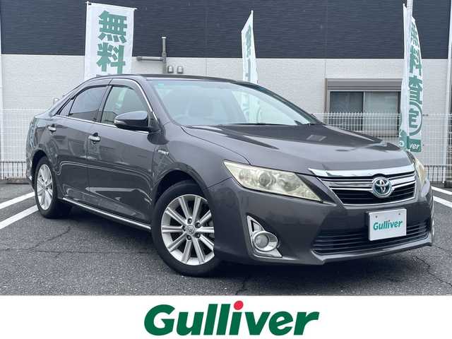 トヨタ カムリ ハイブリット Gパッケージ 三重県 2013(平25)年 6.4万km グレーメタリック 登録時63928km/ワンオーナー/ディーラー７インチＳＤナビ/・フルセグ・Ｂｌｕｅｔｏｏｔｈ・ＣＤ/ＤＶＤ・SD・AM/FM/クルーズコントロール/ＡＵＴＯライト/バックカメラ/パワーシート/ビルドインＥＴＣ/スマートキー/スペアキー/純正フロアマット/電動格納ミラー/革巻きステアリング