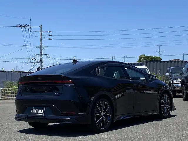 トヨタ プリウス Z 福岡県 2023(令5)年 1.8万km アティチュードブラックマイカ ・ワンオーナー/・Plugin Hybrid/・純正12.3インチSDナビ/Apple Car Play/Android Auto/フルセグTV/BT/USB/・パノラミックビューモニター/・AC100V端子/・モデリスタエアロ（フロント・サイド・リア）/・Toyota Safety Sense/ープリクラッシュセーフティ/ーレーントレーシングアシスト/ーレーンデパーチャーアラート/ープロアクティブドライビングアシスト/ーフロントクロストラフィックアラート/ーロードサインアシスト/ーレーダークルーズコントロール/・BSM/・パワーバックドア/・ブラックレザーシート/・D席パワーシート/メモリーシート/・前席シートヒーター/ベンチレーション/・ステアリングヒーター/・ビルトインETC2.0/・ワイヤレス充電/・LED AUTOヘッドライト/・AUTO ハイビーム/・純正19インチAW/・スマートキー/・ドアバイザー/・保証書/取扱説明書/・スペアキー
