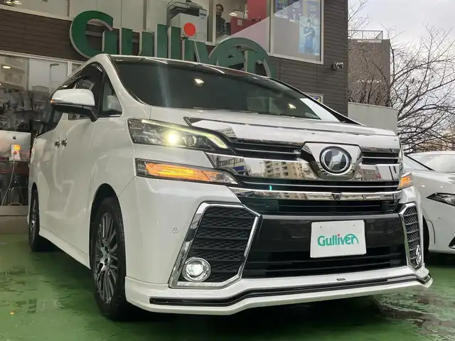 トヨタ ヴェルファイア Z Gエディション 神奈川県 2016(平28)年 8.9万km ホワイトパールクリスタルシャイン JBLサウンドシステム/純正10型ナビ/・AM/FM SD CD BT フルセグTV/レーダークルーズコントロール/nanoeオートエアコン/両側電動スライドドア/パワーバックドア/電動パーキングブレーキ/オートブレーキホールド/アラウンドビューカメラ/ETC/インテリジェントクリアランスソナー/ハーフレザーシート/助手席パワーオットマン/ステアリングヒーター/LEDヘッドライト/LEDイルミネーション/後席サンシェード/自動防眩ミラー