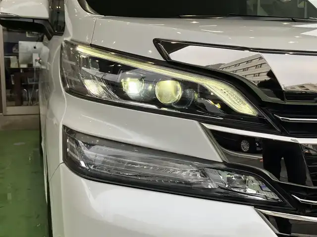 トヨタ ヴェルファイア Z Gエディション 神奈川県 2016(平28)年 8.9万km ホワイトパールクリスタルシャイン JBLサウンドシステム/純正10型ナビ/・AM/FM SD CD BT フルセグTV/レーダークルーズコントロール/nanoeオートエアコン/両側電動スライドドア/パワーバックドア/電動パーキングブレーキ/オートブレーキホールド/アラウンドビューカメラ/ETC/インテリジェントクリアランスソナー/ハーフレザーシート/助手席パワーオットマン/ステアリングヒーター/LEDヘッドライト/LEDイルミネーション/後席サンシェード/自動防眩ミラー
